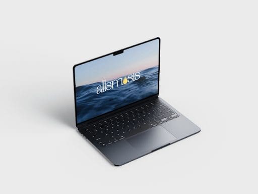 A sleek laptop with a thin design on a plain background displays a screen with an ocean view and the word "allsmosis" in stylish typography.