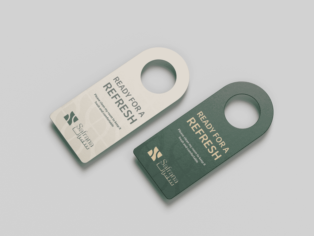 Two door hangers, one cream and one dark green, both read "Ready for a Refresh." Elegant, modern design with brand logo "Safrana."